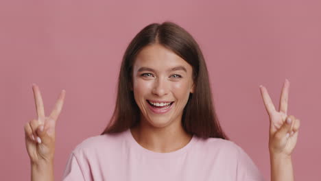 woman making a peace sign