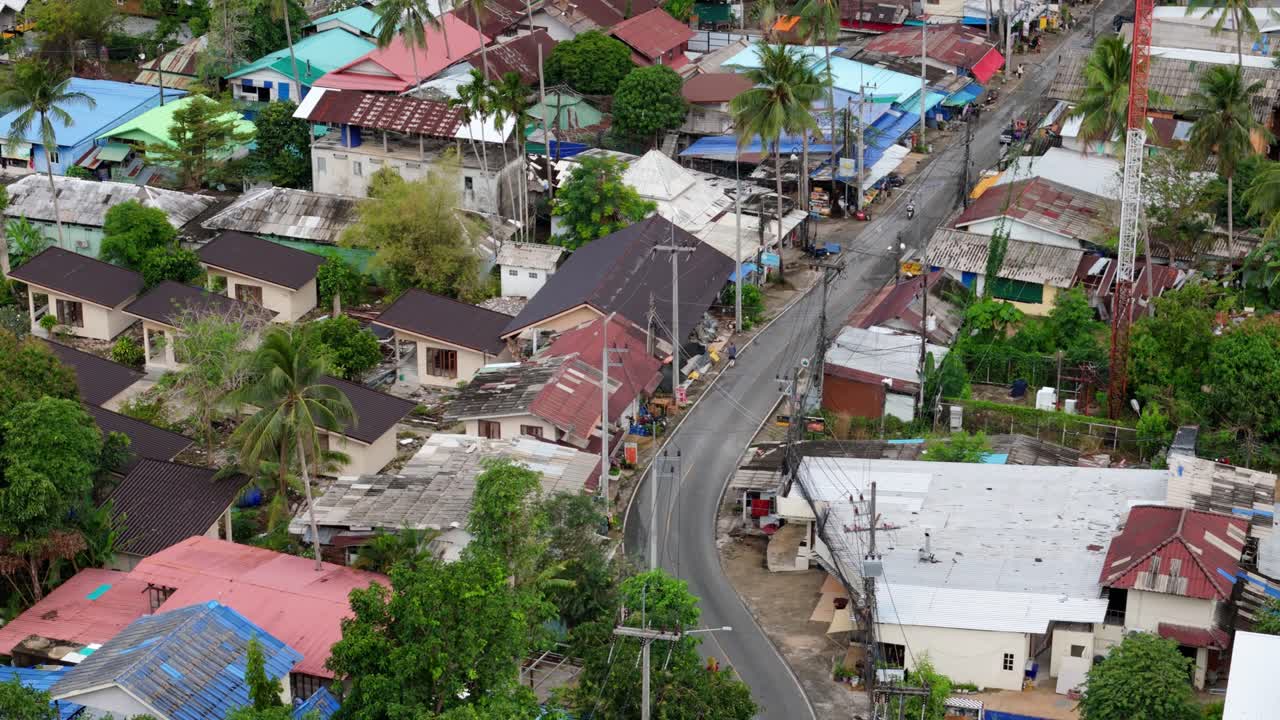 A birds-eye view of Lonely Beach on Koh Chang, Thailand showing the village, shops, main road and guest house accommodation
