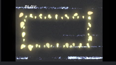 animation of frame of glowing yellow christmas fairy lights on playback screen, with interference