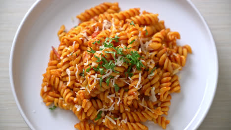 spiral or spirali pasta with tomato sauce and cheese - italian food style