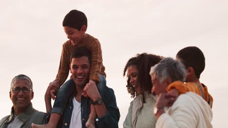 happy, beach and big family walking on holiday