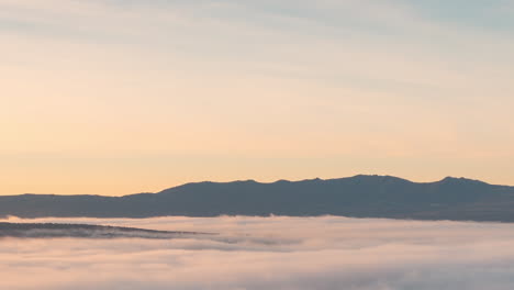 low clouds during sunrise timelapse un la pedriza, madrid, spain