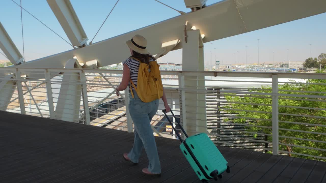 Female Traveler Walking on Airport Jet Bridge Before Boarding