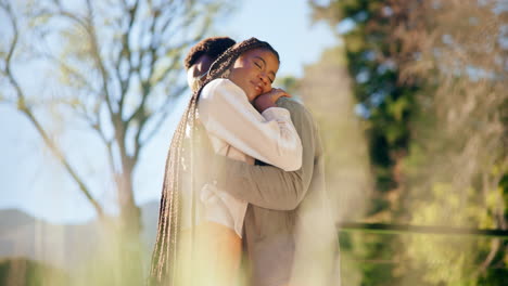 couple hugging outdoors