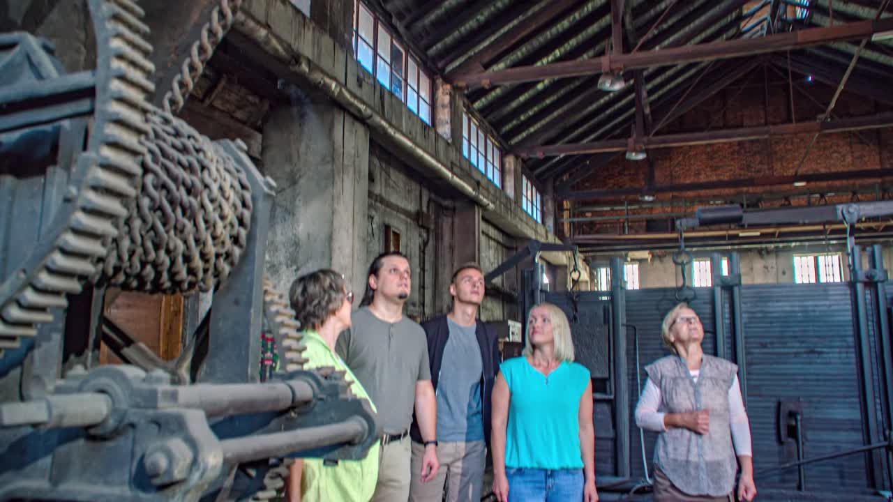 Guided group visit Steel Museum, metal industry factory shop floor. Tilt down