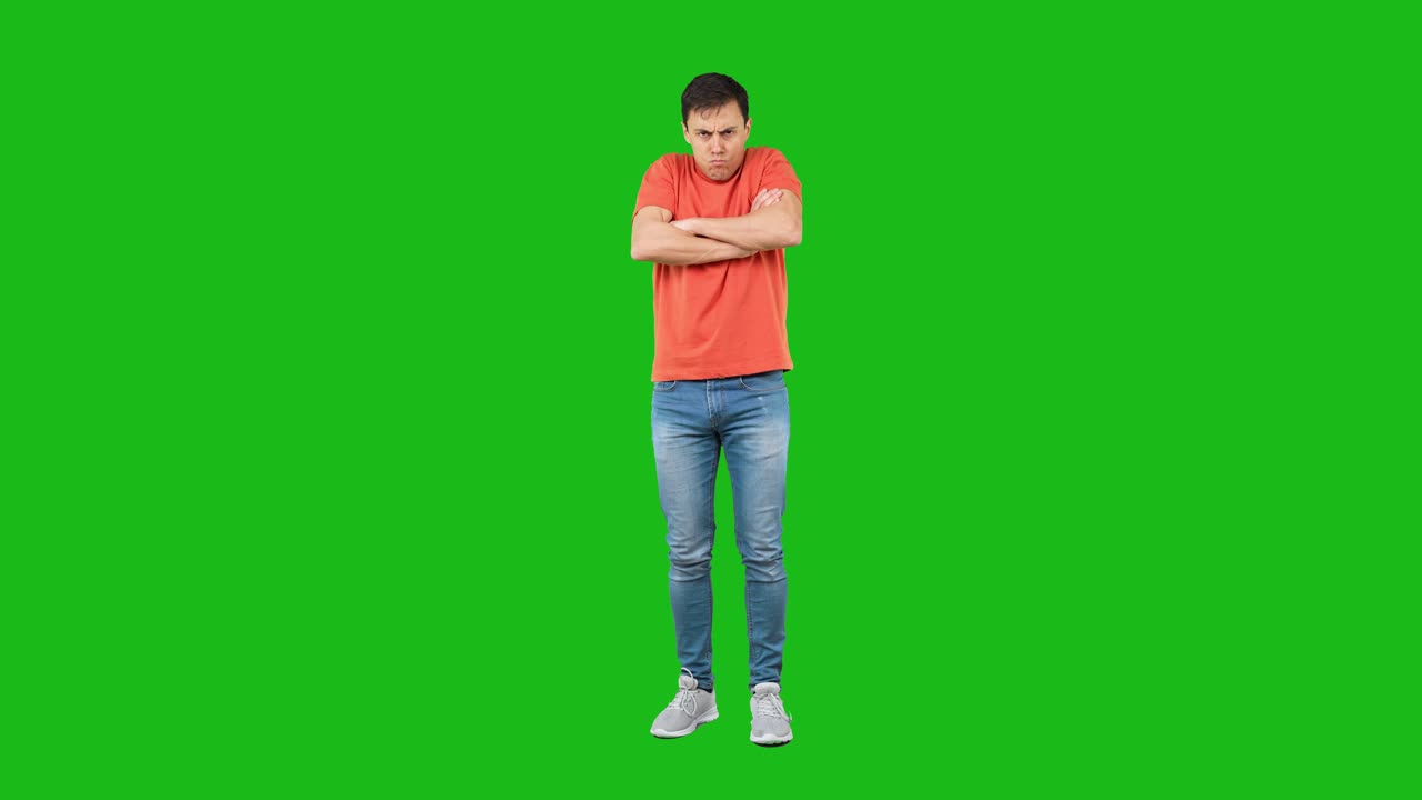 Man Feeling Cold or Displeased with Arms Crossed on Green Screen