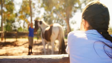 girl waving hand to her mother in ranch 4k