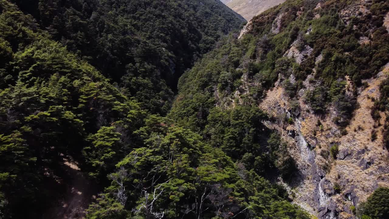 AERIAL Fly-by over a Stunning Mountain Valley deep in the Mountains of South Island, New Zealand