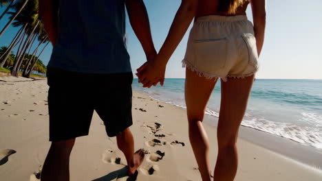 couple walking on a tropical beach