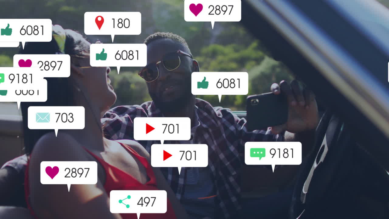 Taking selfie in car, couple with animation of social media notifications