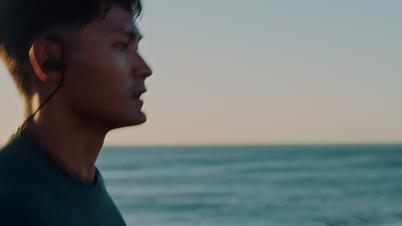 Running, music and beach of man in fitness