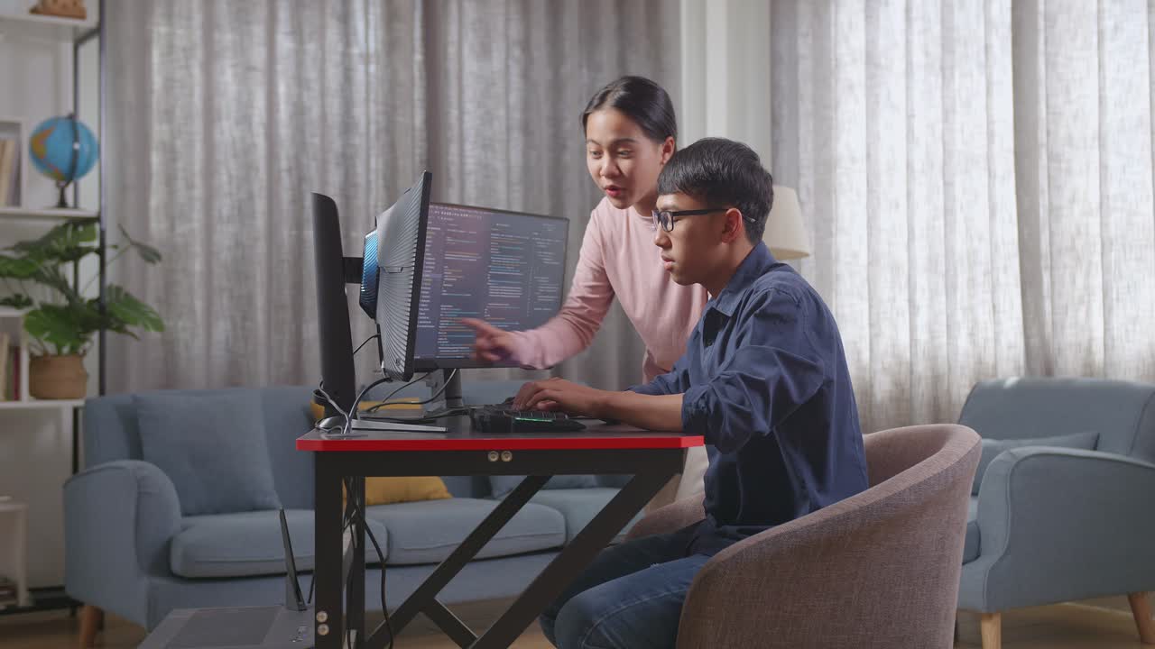 Student learning coding from a teacher at home