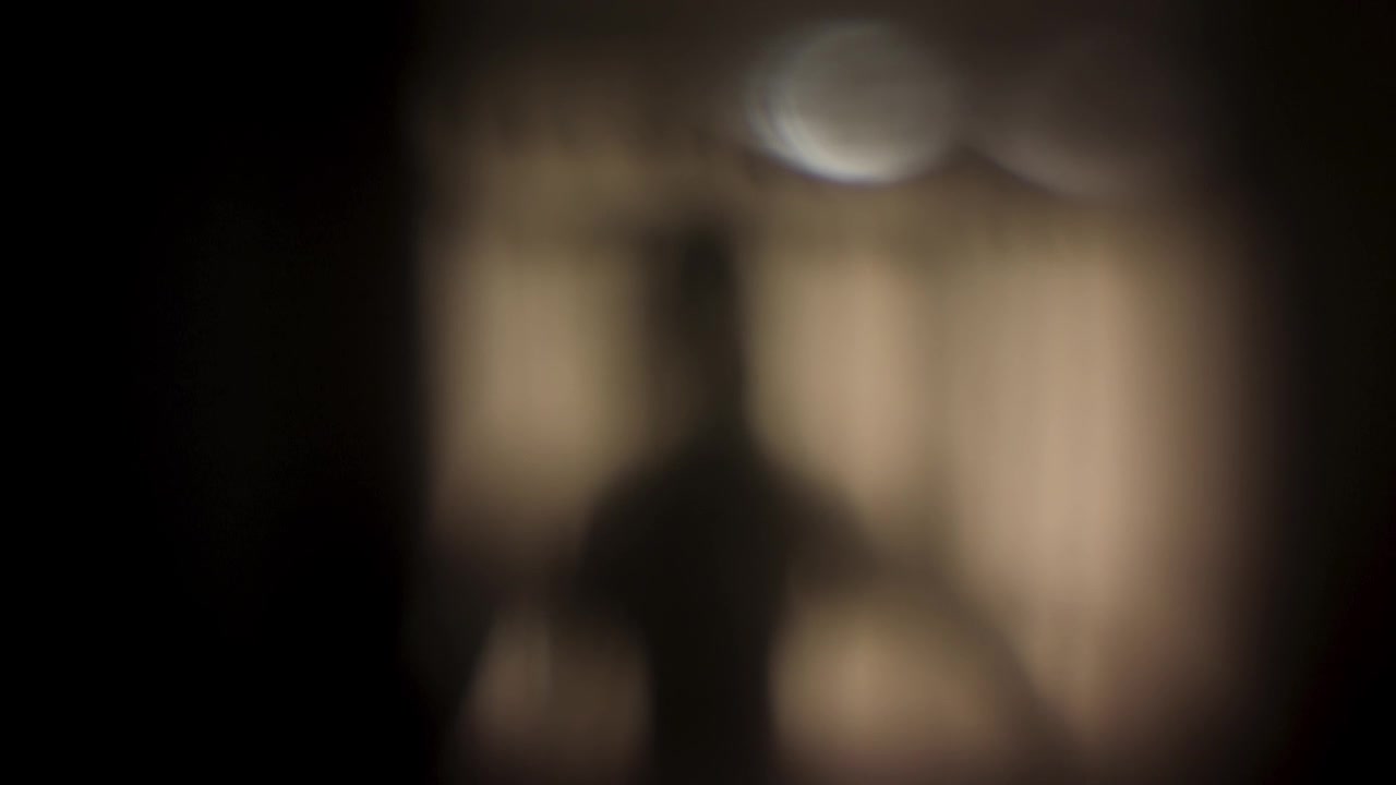 Ghostly ghoulish figure entering frame and pointing around like a skeleton hand alien looking apparition