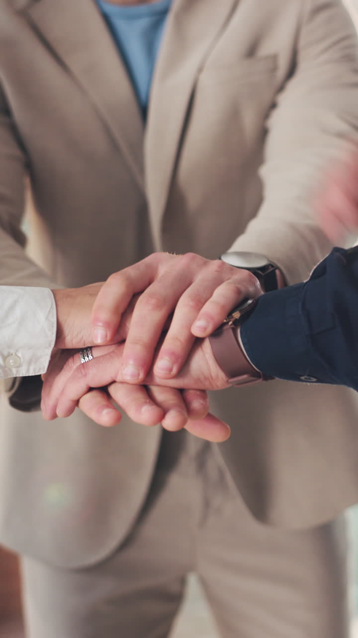 Close-up of Business Team Stacking Hands for Collaboration and Unity