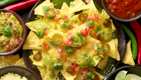 fresh yellow corn nacho chips on ceramic plate