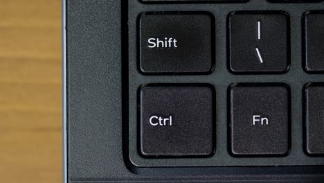 top view finger pushing ctrl keyboard button