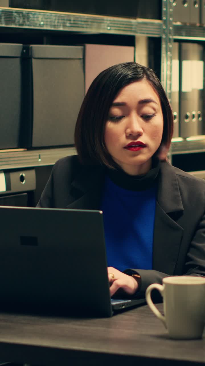 Vertical Video Private agent calls forensic experts on landline phone in archive