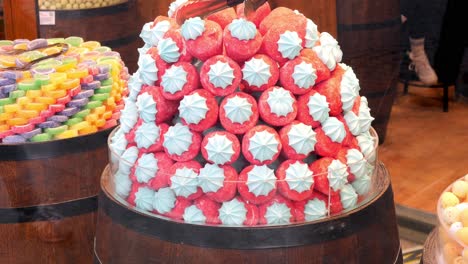 a display of pink and blue marshmallows in a candy store