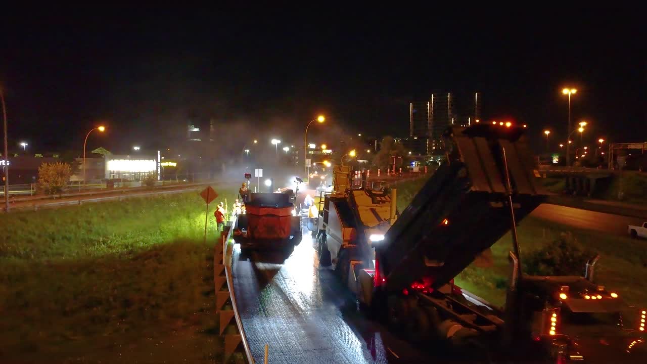 Nighttime Asphalt Paving on Highway
