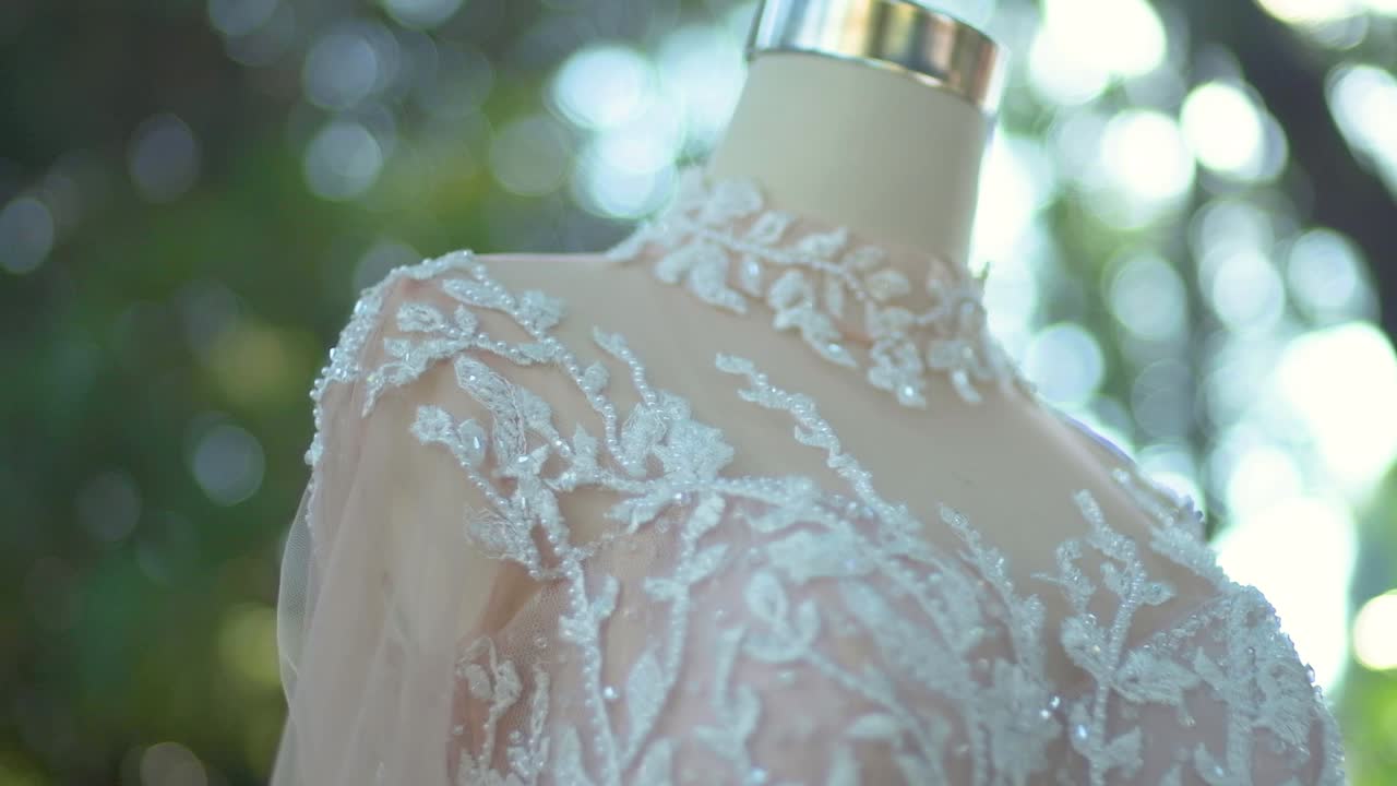 Close up of nude cream wedding dress on a mannequin