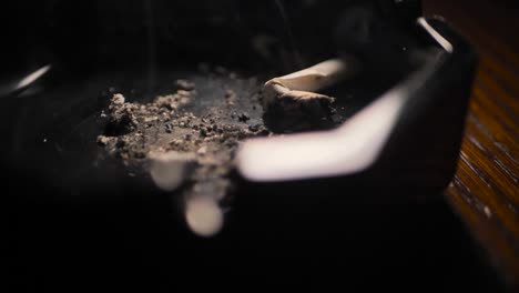 Close-up-smoking-cigarette-on-man-hand