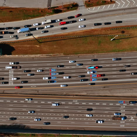 Private transport going by the multi-lane roads. Top view on the highway at daytime.