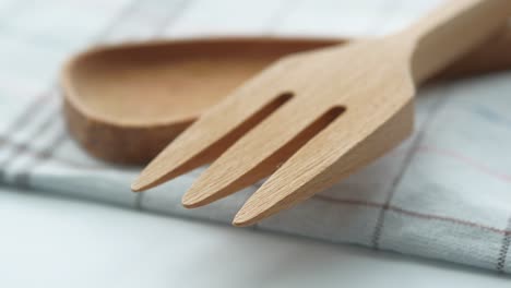 wooden utensils on a checkered napkin