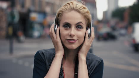 slow motion portrait of happy beautiful caucasian punk woman listening to music