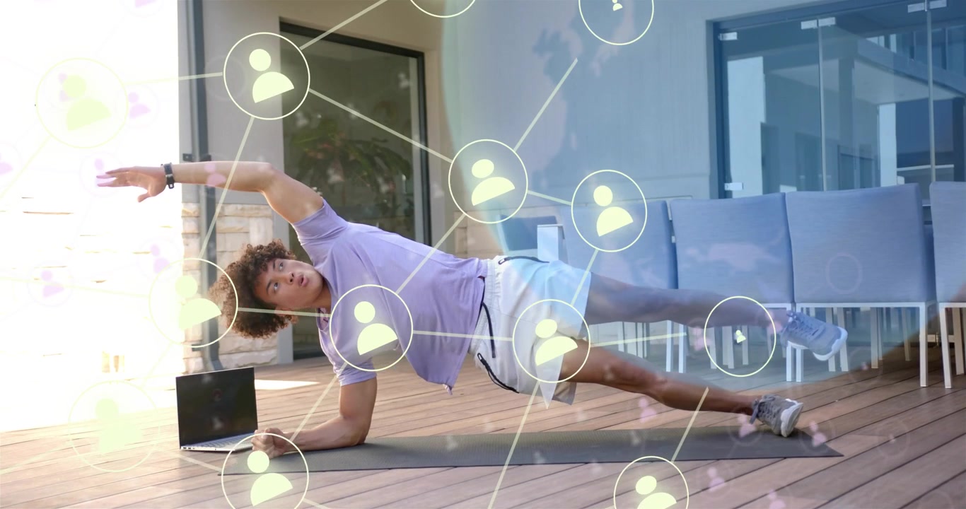 Man performing guided side-plank on deck, following laptop workout while network graphic overlaying