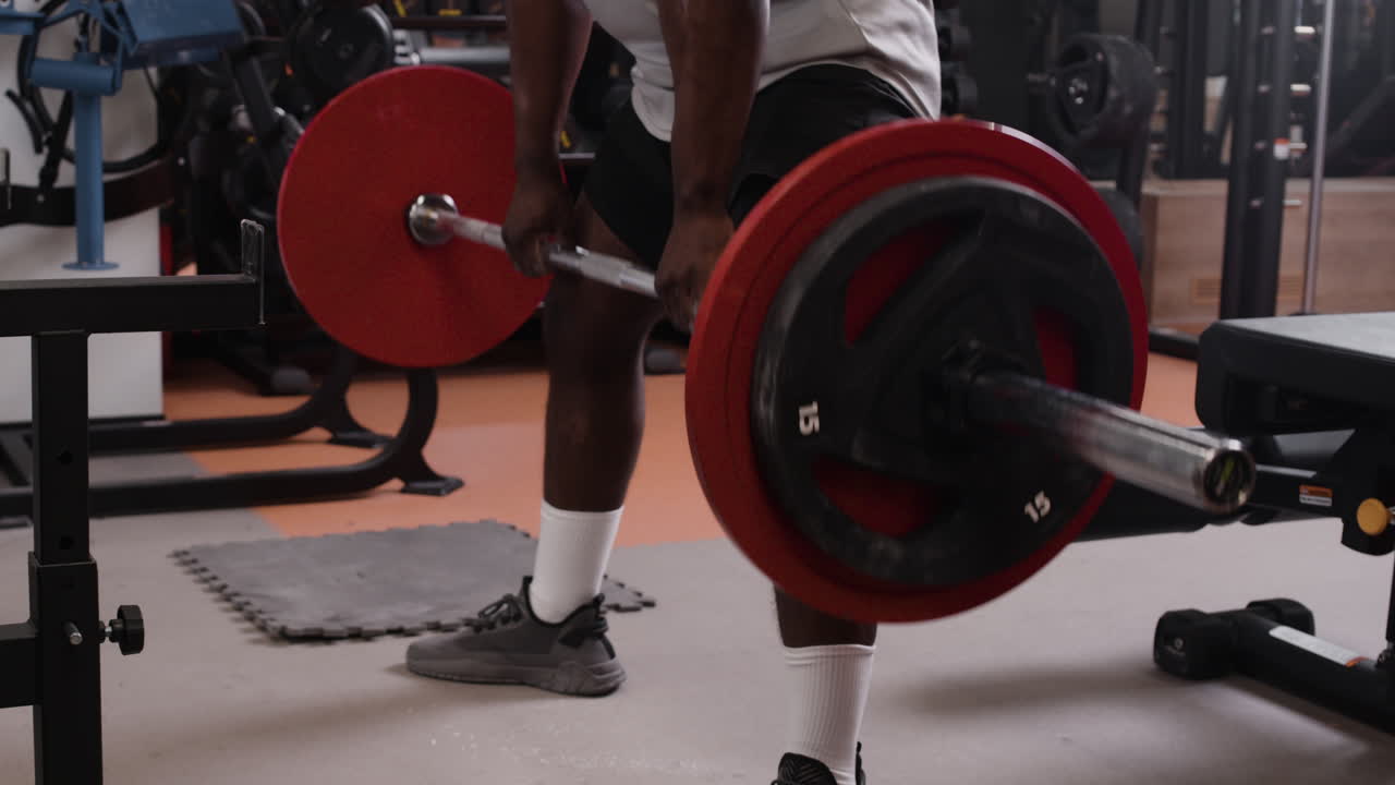 Man Deadlifting in Gym