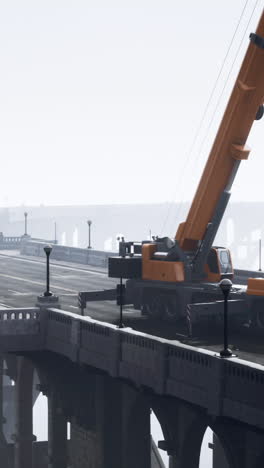 crane on bridge in fog