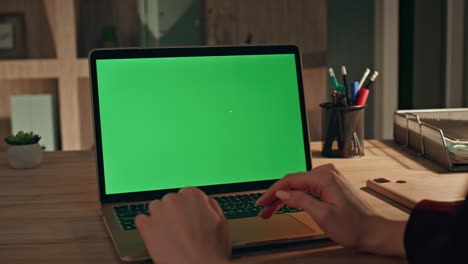 unknown freelancer using mockup laptop for online work at home office closeup.