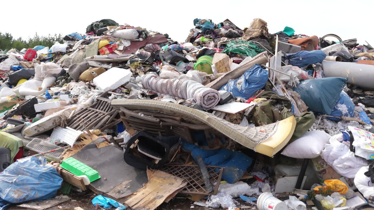Landfill garbage dump with waste materials destined for incineration, slider