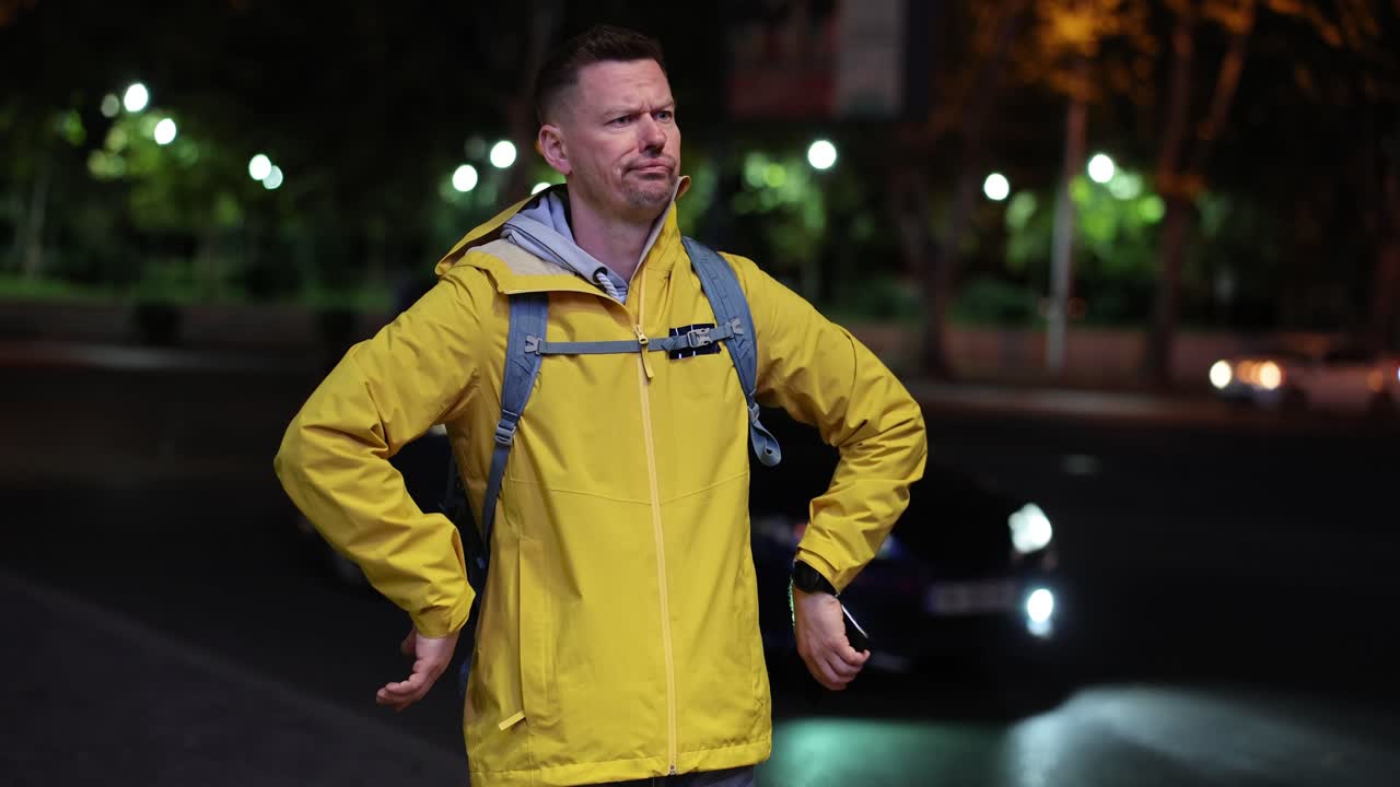 Man in Yellow Jacket at Night
