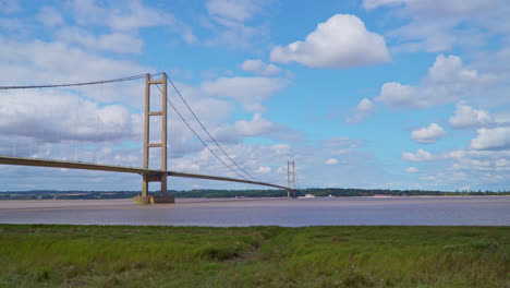 Delight-in-this-drone-video-featuring-Humber-Bridge,-the-12th-largest-suspension-span-on-Earth,-stretching-over-River-Humber,-facilitating-traffic-between-Lincolnshire-and-Humberside