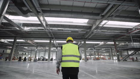 man walking in new modern warehouse