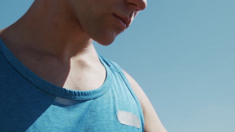 close up view of male rower looking at his watch