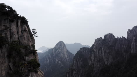 aerial flight over huangshan peaks in anhui province, china