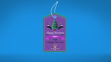 animation of christmas logo with christmas text over blue background