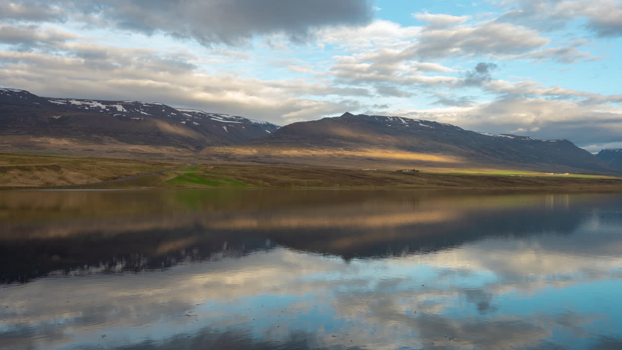 Iceland Highlands, Timelapse of Clouds and Sky and Their Reflection on Glacial Lake Under Scenic Volcanic Mountain