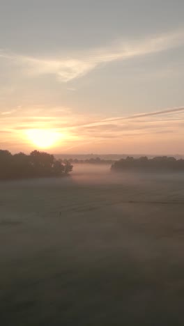 misty sunrise over a golf course