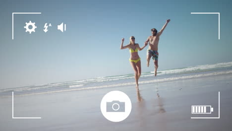tomando fotos de una pareja con una cámara digital