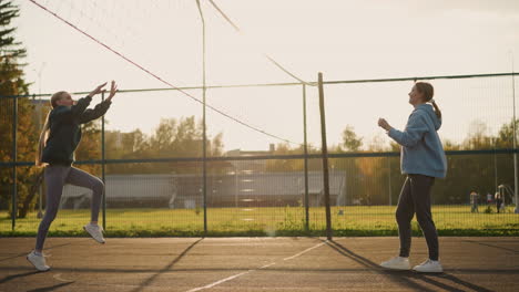 volleyball beginner practicing ball reception, background features open field with blurry view of someone pushing bicycle and other people walking in park