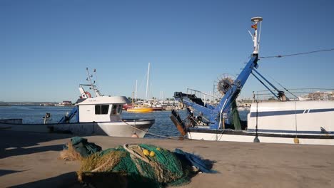 fishing nets and boats, with a taxi boat in the background