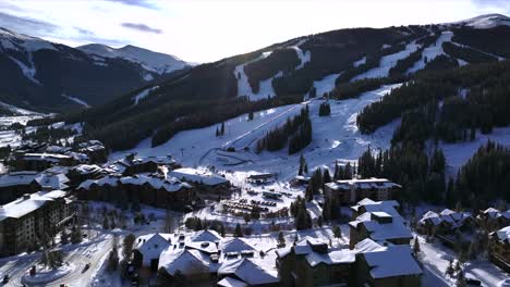 morning sunrise winter solstice copper mountain resort aerial drone center village chairlifts gondola ikon pass alterra snowboarding snow ski riding trails december halfpipe trees forward reveal pan