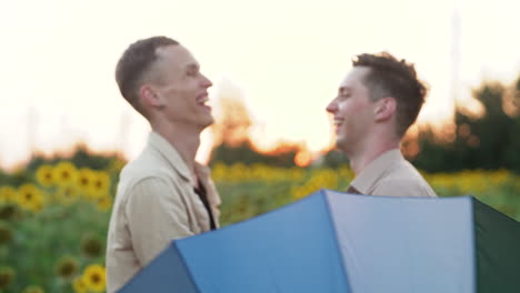 men behind rainbow umbrella