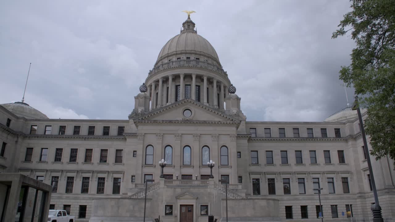 Time-lapse, wide: Stormy skies over the Mississippi State Capitol building. Jackson, MS