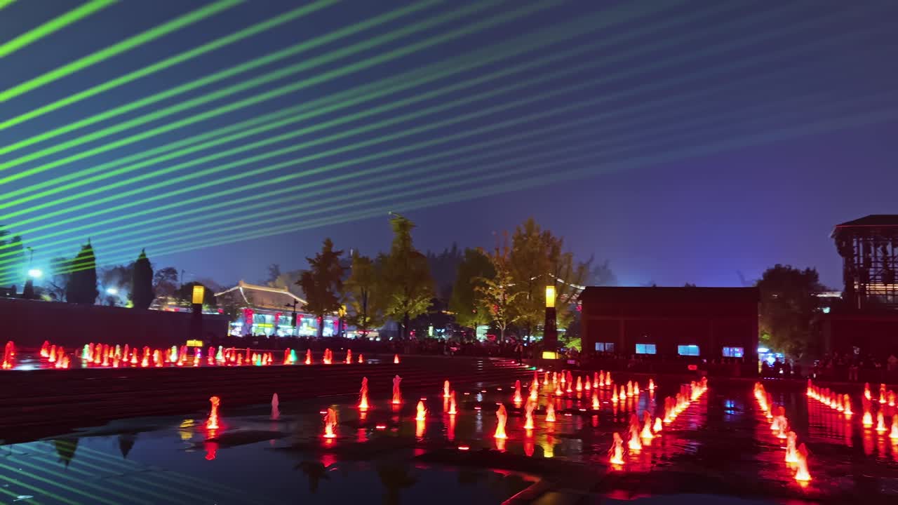 Musical Fountain, Giant Wild Goose Pagoda, Xi'an, China - Vibrant Nighttime Displays Feature Colorful Lights and Water Jets Synchronized to Music - Panning Shot