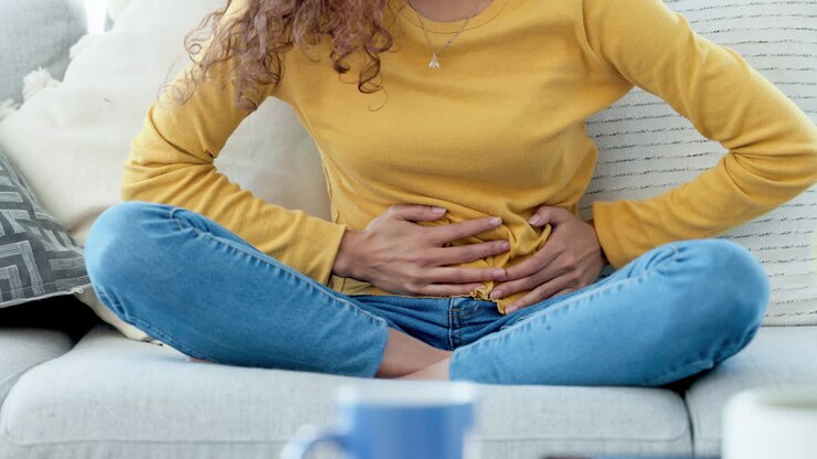 Closeup of a woman with period cramps rubbing