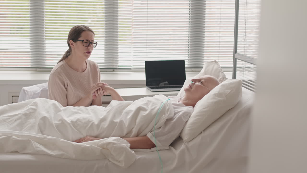 Woman Supporting Friend with Cancer in Hospital